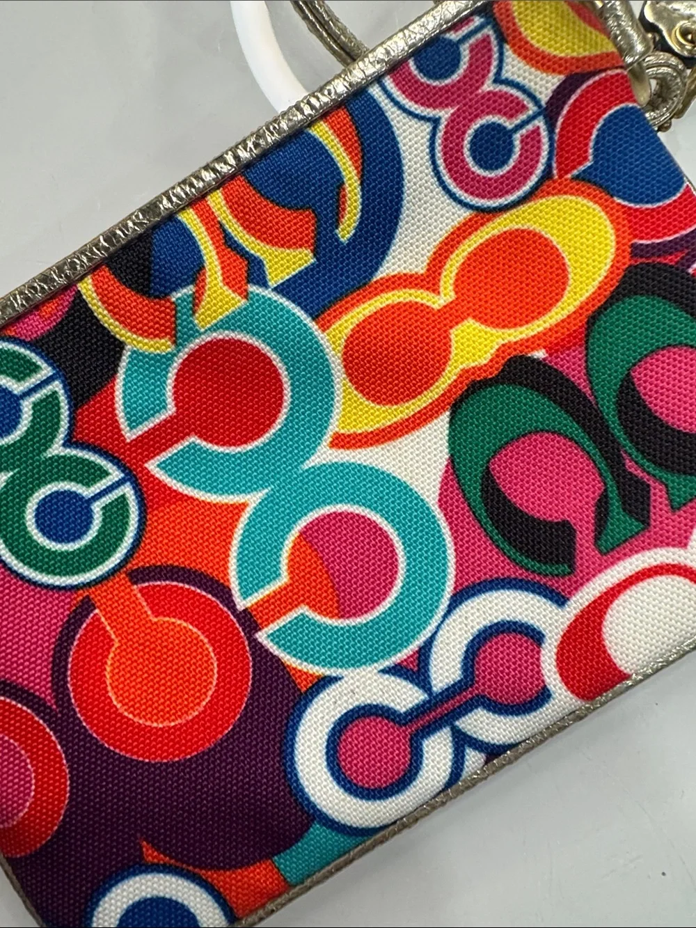 Coach Poppy Multicolor signature wristlet with gold accents and hangtag